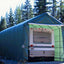 14x42x17 RV/Boat Garage House Style, green, with RV inside, rear view